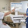 CyberMed NB24 in Hospital with Patient Touching Screen Thumbnail